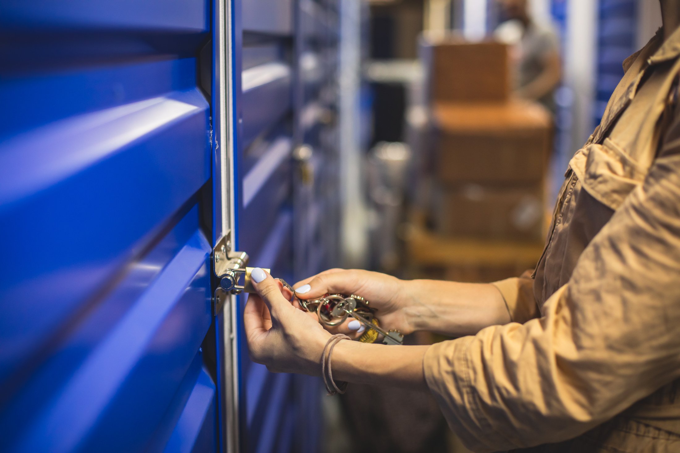 View of self storage warehouse, process of keeping and storing the goods and items in storage units, self-storage building, lock and key concept